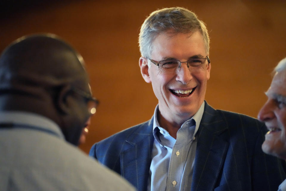 FILE - Rep. Tom Rice, R-S.C., talks with donors at a campaign fundraiser in Latta, S.C., on Feb. 24, 2022. U.S. Rep. Tom Rice of South Carolina has brought in nearly $342,000 during the first quarter of this year, giving the Republican a war chest of $2 million as he tries to stave off a slew of primary challengers, including one with the backing of former President Donald Trump.(AP Photo/Meg Kinnard, File)