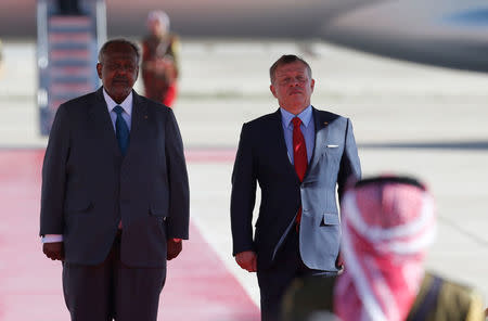 Jordan's King Abdullah II stands next to Djibouti's President Ismail Omar Guelleh during a reception ceremony at the Queen Alia International Airport in Amman, Jordan March 28, 2017. REUTERS/Muhammad Hamed