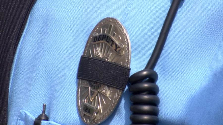 A black ban encircles a badge. (KSN News Photo)