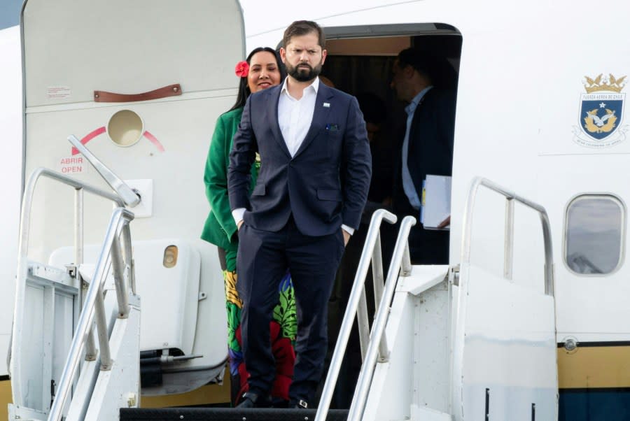 Chilean President Gabriel Boric and First Lady Irina Karamanos arrive at San Francisco International Airport on November 15, 2023. (Photo by JASON HENRY/AFP via Getty Images)