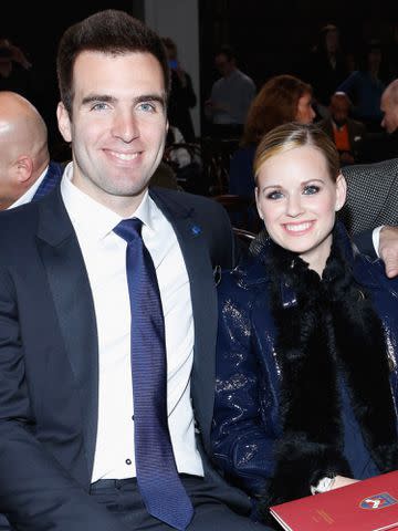 <p>Cindy Ord/Getty</p> Joe Flacco and his wife Dana Flacco attend the Tommy Hilfiger Men's Fall 2013 fashion show during Mercedes-Benz Fashion Week on Feb. 8, 2013 in New York City.