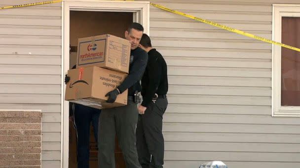 PHOTO: Police start removing belongings from the Moscow, Idaho, house where four University of Idaho students were killed. (KXLY)