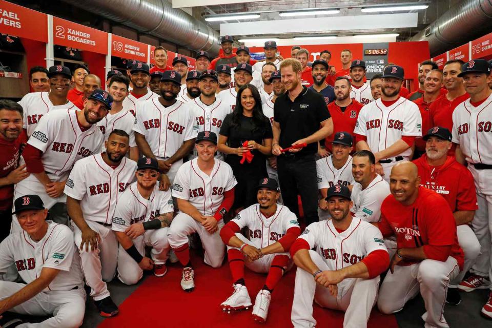 Prince Harry, Duke of Sussex and Meghan, Duchess of Sussex pose for a group photo with the Boston Red Sox before a game against the New York Yankees at London Stadium on June 29, 2019 in London, England. The game is in support of the Invictus Games Foundation.