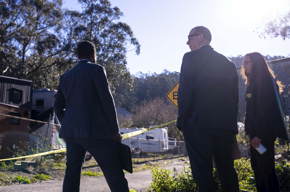 FBI officials gather together before entering the crime scene at Mountain Mushroom Farm, Tuesday, Jan. 24, 2023, after a gunman killed several people at two agricultural businesses in Half Moon Bay, Calif. Officers arrested a suspect in Monday’s shootings, 67-year-old Chunli Zhao, after they found him in his car in the parking lot of a sheriff’s substation, San Mateo County Sheriff Christina Corpus said. (AP Photo/Aaron Kehoe)