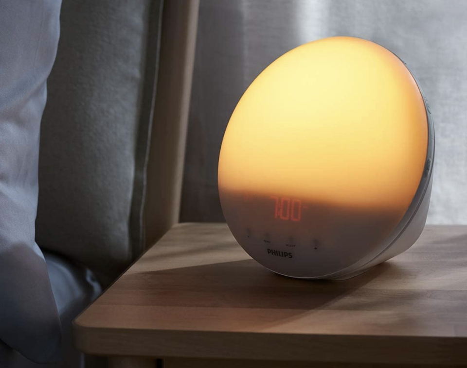 Philips Wake-Up Light Coloured Sunrise Simulation on night stand  (Photo via Amazon)