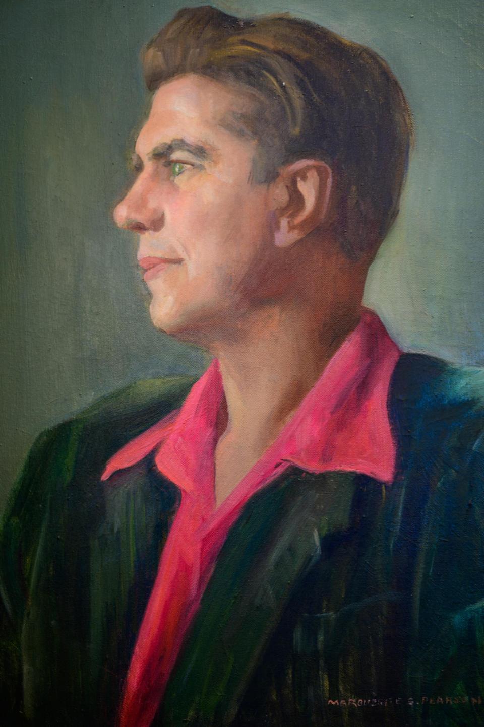 A portrait of Kenneth Worcester Dow hangs in the lobby of The  Collector Luxury Inn & Gardens on Cordova Street in St. Augustine. Dow, who died in 2002 at the age of 90, was the former owner of the property and collected many of the antiques that decorated the museum.