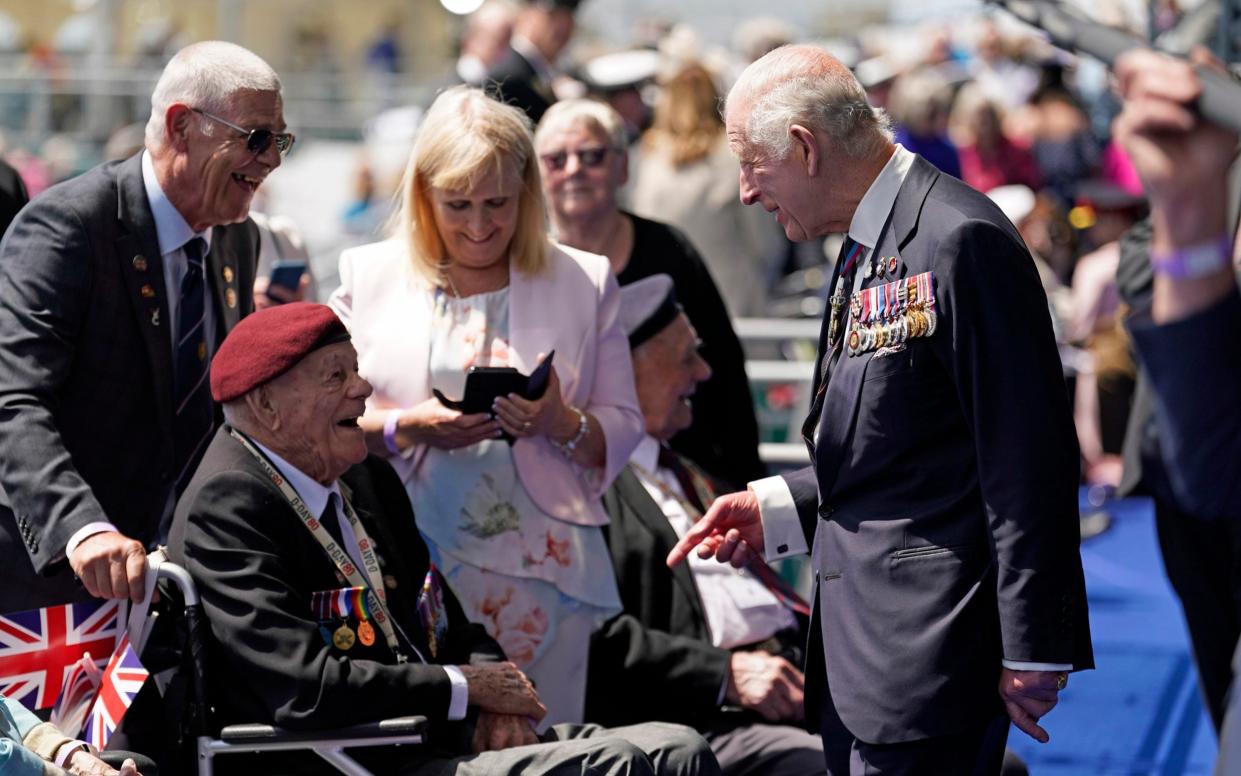 King Charles shares a moment of light humour with a D-Day veteran amid 80th anniversary commemorations