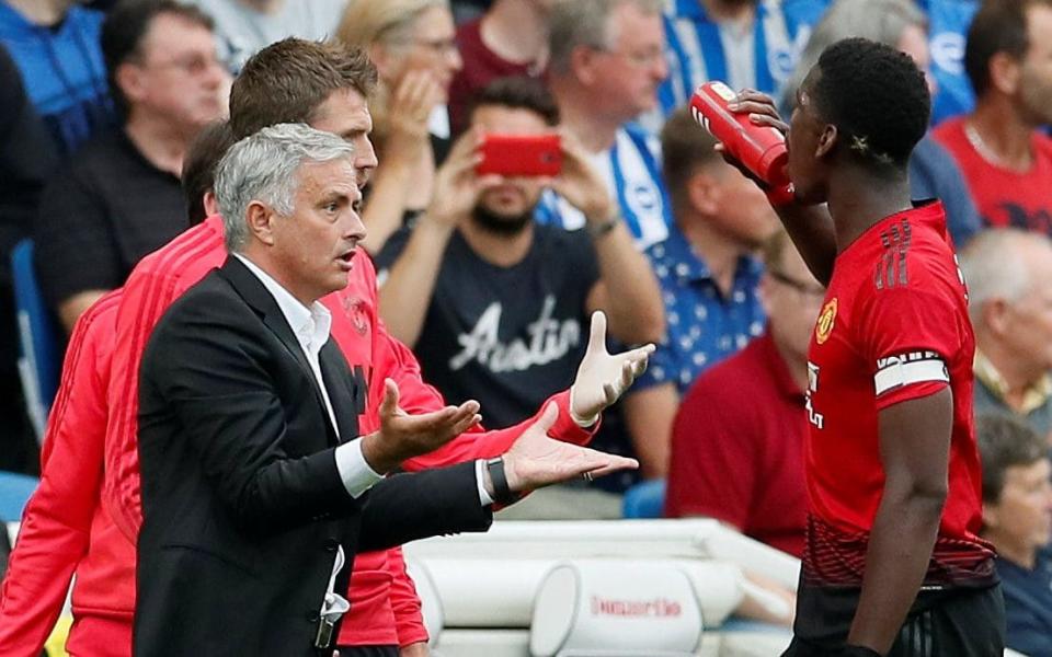 Asking questions: Jose Mourinho and Paul Pogba - REUTERS