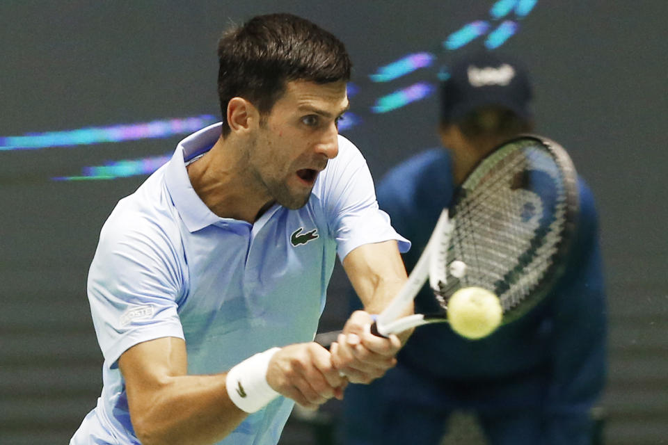 Serbia's Novak Djokovic returns the ball to Stefanos Tsitsipas of Greece during their ATP 500 Astana Open tennis tournament final match in Astana, Kazakhstan, Sunday, Oct. 9, 2022. (AP Photo/Stas Filippov)