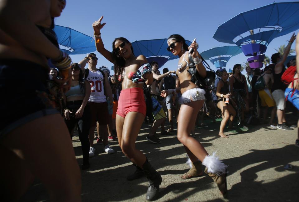 Festival goers dance at the Coachella Valley Music and Arts Festival in Indio