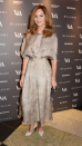 <p> We love a dress with a feminine silhouette. Woodall wore a mink-hued midi dress to a private dinner celebrating the Victoria and Albert Museum's new exhibition 'The Glamour Of Italian Fashion 1945 - 2014' in London in 2014. It featured an elegant, nipped-in waist, and she finished off the look with heels. </p>
