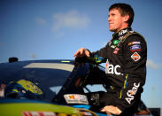 HOMESTEAD, FL - NOVEMBER 19: Carl Edwards, driver of the #99 Aflac Ford, climbs out of his car after qualifying for pole position in the NASCAR Sprint Cup Series Ford 400 at Homestead-Miami Speedway on November 19, 2011 in Homestead, Florida. (Photo by Jared C. Tilton/Getty Images)