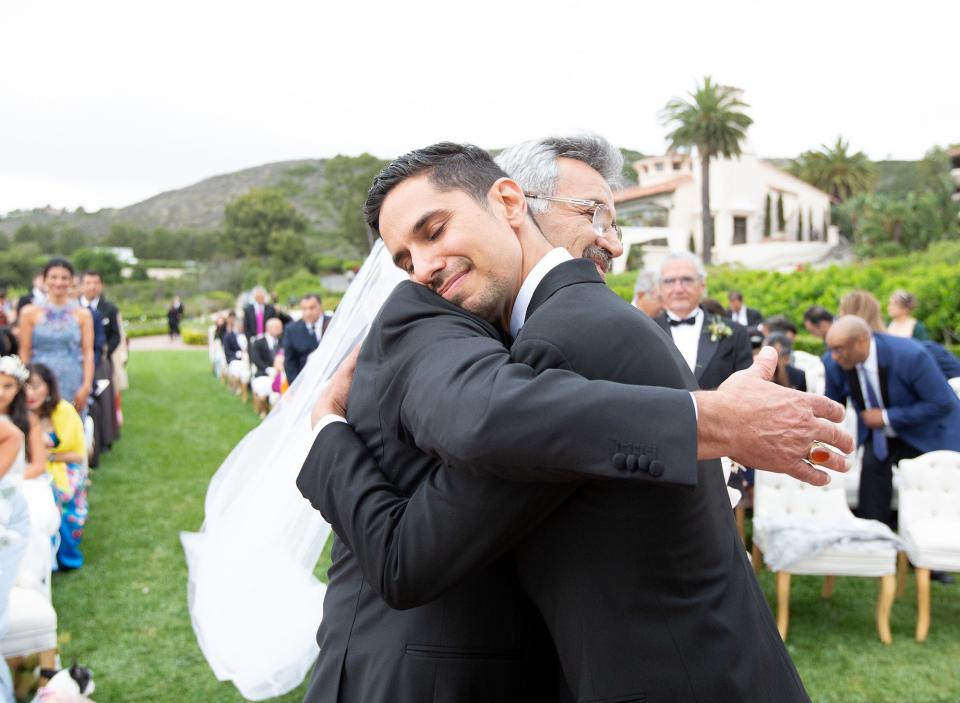 João hugging my father, Oscar Bakhtiari, before my father gives him my hand.