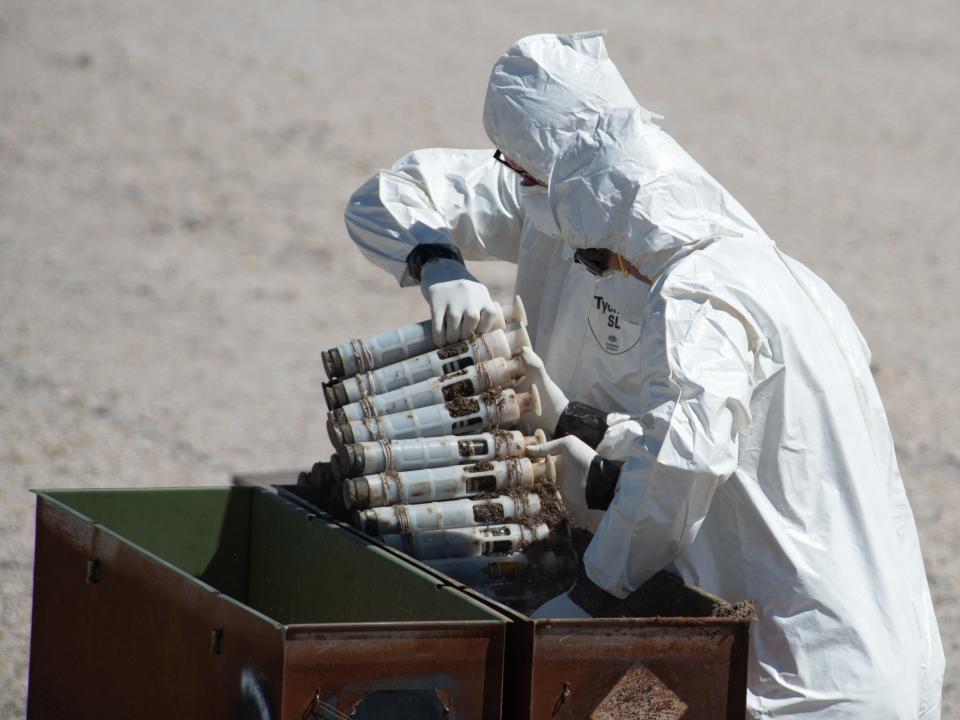 U.S. Air Force National Guard Master Sgt. Derin Creek and Staff Sgt. Cody Bialcak, Explosive Ordnance Disposal Techinicians, safely remove over 500 depleted uranium rounds on June 23, 2022 at Tooele Army Depot, UT.