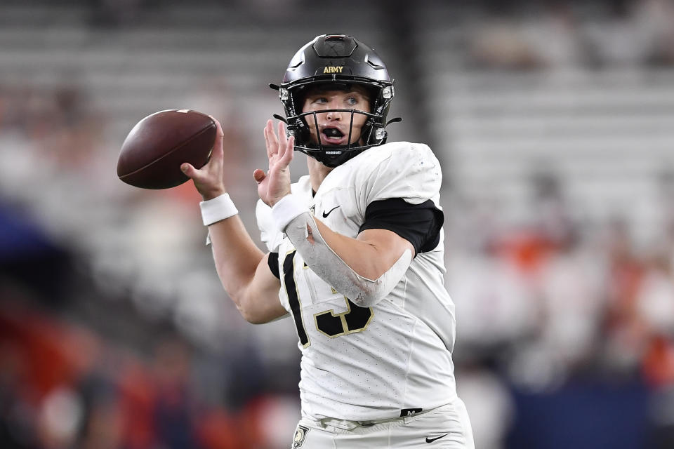 Army quarterback Bryson Daily (13) looks to pass during the second half of an NCAA college football game against Syracuse in Syracuse, N.Y., Saturday, Sept. 23, 2023. (AP Photo/Adrian Kraus)