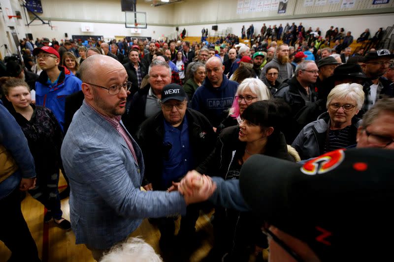 FILE PHOTO: Peter Downing one of the organizers of a rally for Wexit Alberta, a separatist group seeking federal political party status, meets supporters after speaking in Calgary