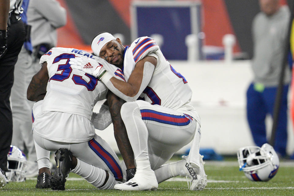 Buffalo Bills' Siran Neal (33) and Nyheim Hines react after teammate Damar Hamlin was injured during the first half of an NFL football game against the Cincinnati Bengals, Monday, Jan. 2, 2023, in Cincinnati. (Jeff Dean / AP)