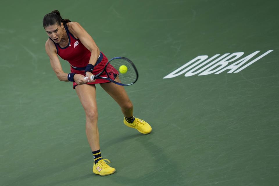 Solana Cirstea of Romania returns the ball to Jasmine Paolini of Italy during a semi final match of the Dubai Duty Free Tennis Championships in Dubai, United Arab Emirates, Friday, Feb. 23, 2024. (AP Photo/Kamran Jebreili)