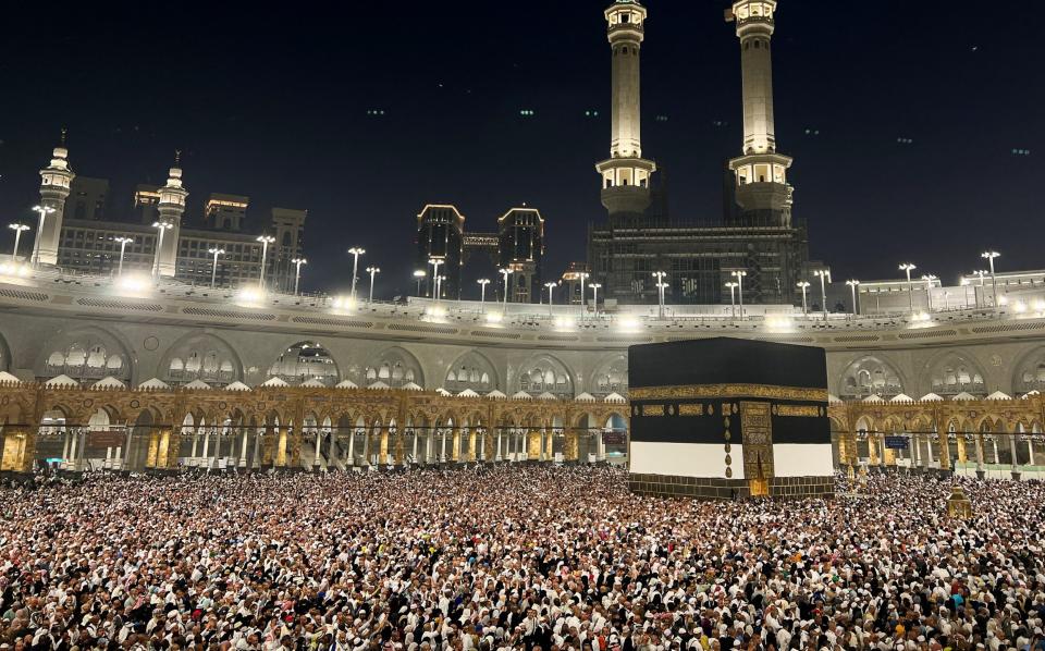 Pilgrims circle the Kaaba at the Grand Mosque as they perform Tawaf