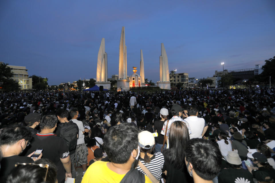 Thai anti-government protesters gather front of the Democracy Monument in Bangkok, Thailand, Saturday, July 18, 2020. Several thousand anti-government protesters have rallied in the Thai capital Bangkok to call for a new constitution, new elections and an end to repressive laws. (AP Photo/Nathathida Adireksarn)