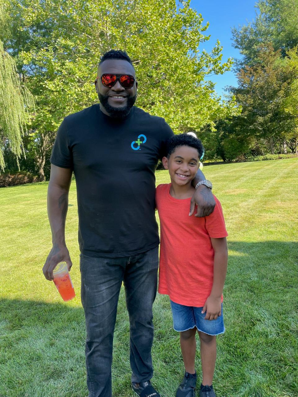 Fall River resident Aviyen Merced filmed his second TV commercial with baseball great David Ortiz in 2022.