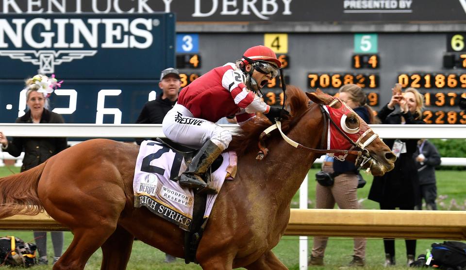 Rich Strike with Jockey Sonny Leon up, crosses the finish line to win the 148th running of The Kentucky Derby Saturday, May 7 2022 in Louisville Ky.