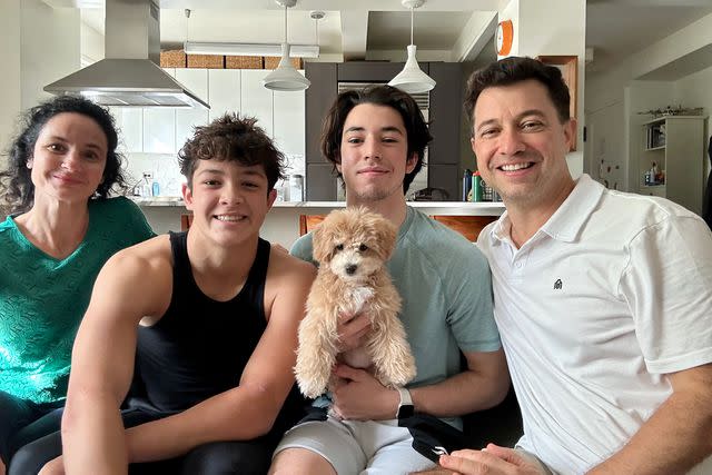 <p>Courtesy of Dan Schachner</p> Dan Schachner (far right) with his family, including new puppy Whistle