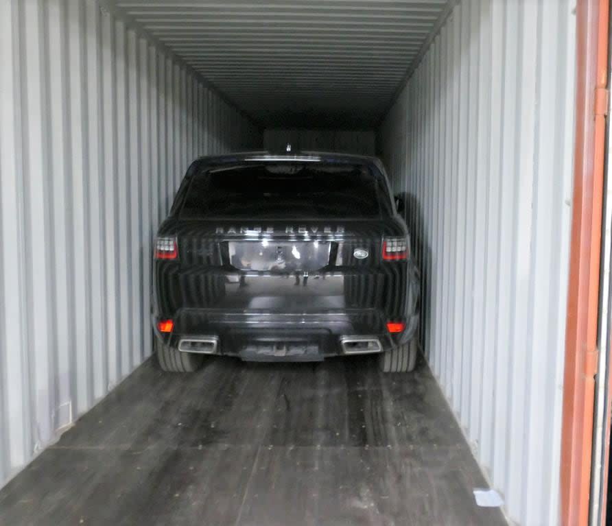 On Dec. 14, a search warrant was executed at a warehouse in Mississauga and stolen vehicles were found inside shipping containers, police say. (York Regional Police - image credit)