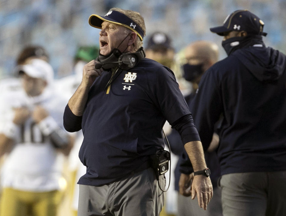 FILE - In this Nov. 27, 2020, file photo, Notre Dame head coach Brian Kelly directs his team during the second quarter of an NCAA college football game against North Carolina at Kenan Stadium in Chapel Hill, N.C. (Robert Willett/The News & Observer via AP, File