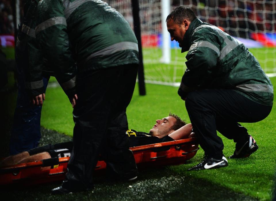 McManaman was stretchered off in his final Premier League game for Wigan just days after they won the FA Cup (Getty)