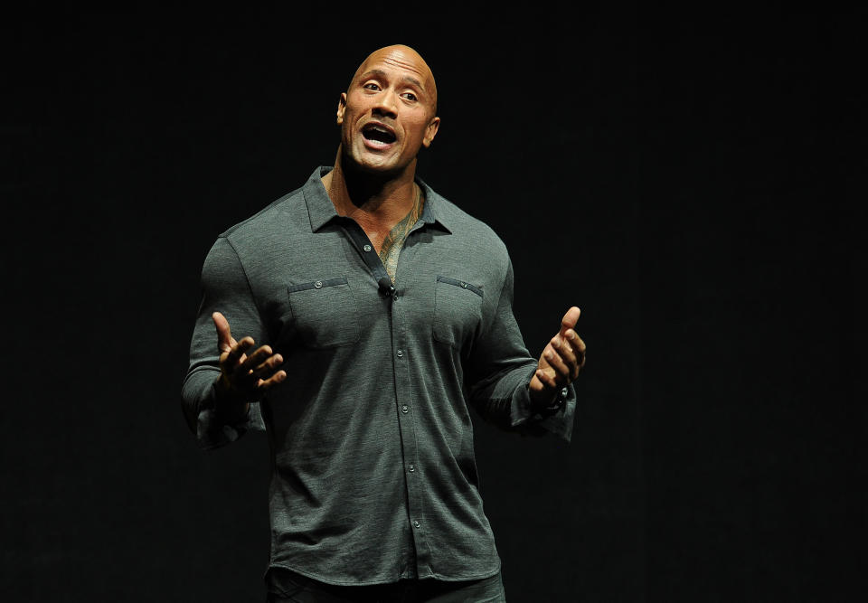 Dwayne Johnson, star of the upcoming film "Hercules," introduces a clip from the film at the Opening Night Presentation from Paramount Pictures at CinemaCon 2014 on Monday, March 24, 2014, in Las Vegas. (Photo by Chris Pizzello/Invision/AP)