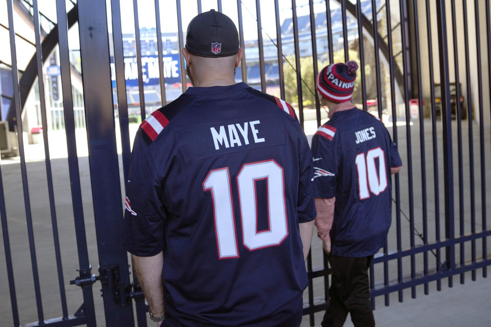 Fans look onto the field at Gillette Stadium following a media availability with New England Patriots first round NFL football draft pick Drake Maye, Friday, April 26, 2024, in Foxborough, Mass. (AP Photo/Charles Krupa)