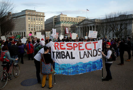 People protest against U.S. President Donald Trump's directive to permit the Dakota Access Pipeline during a demonstration at the White House in Washington, U.S., February 8, 2017. REUTERS/Joshua Roberts