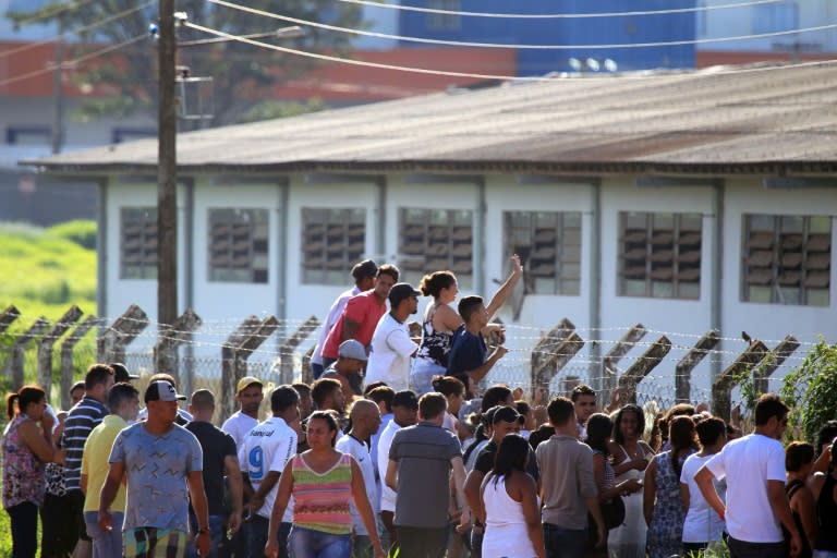 Relatives of inmates wait for information outside the Coronel Odenir Guimaraes prison in Goias state following a deadly New Year's Day riot