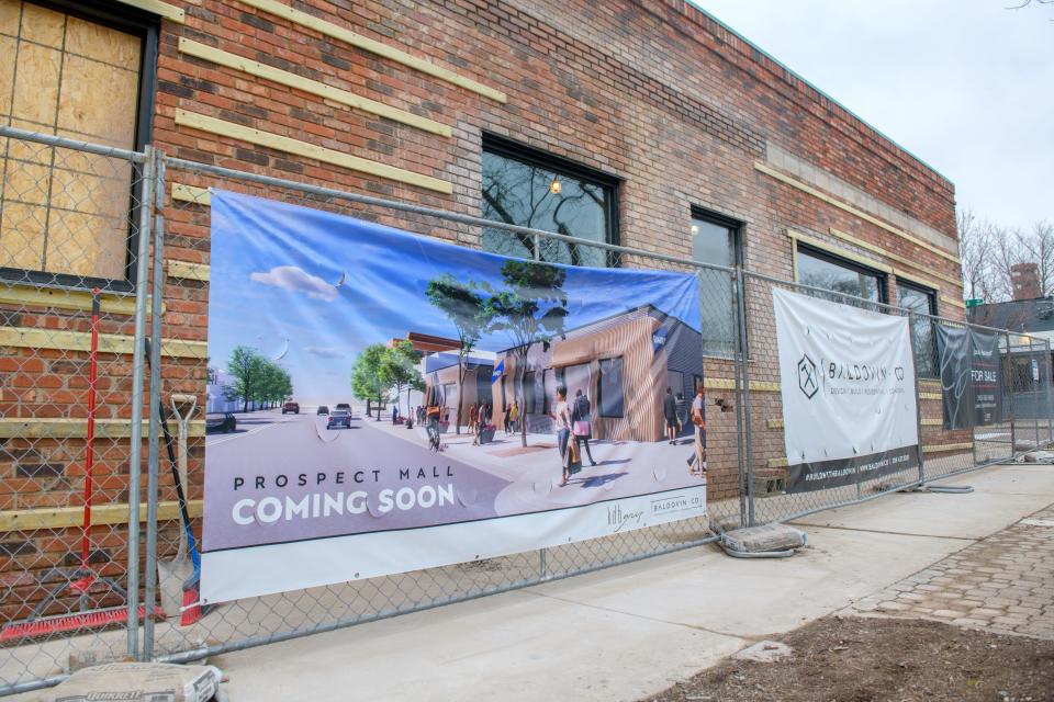 A banner hanging from the fence around the Prospect Mall development depicts what the Peoria Heights property might look like when it's completed.