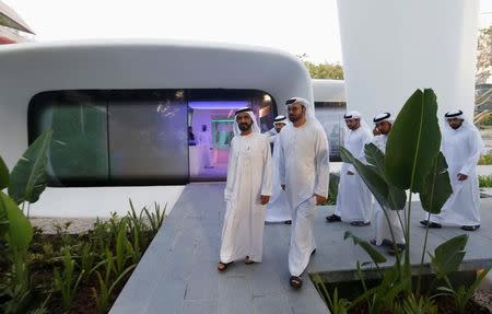 Sheikh Mohammed bin Rashid Al Maktoum (L), Vice-President and Prime Minister of the UAE and Ruler of Dubai, arrives for the official opening of the the first world functional 3D printed offices in Dubai May 23, 2016. REUTERS/Ahmed Jadallah