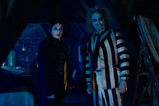 <p>Courtesy of Warner Bros. Pictures</p> Winona Ryder and Michael Keaton in "Beetlejuice Beetlejuice"