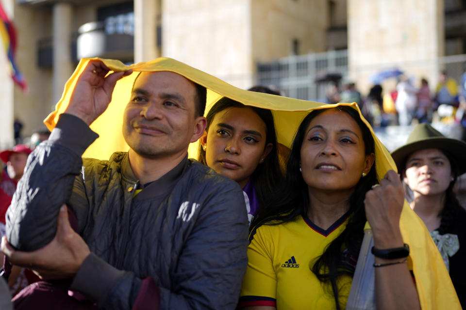 Supporters of new President Gustavo Petro attend his swearing-in ceremony at the Bolivar square in Bogota, Colombia, Sunday, Aug. 7, 2022. (AP Photo/Ariana Cubillos)