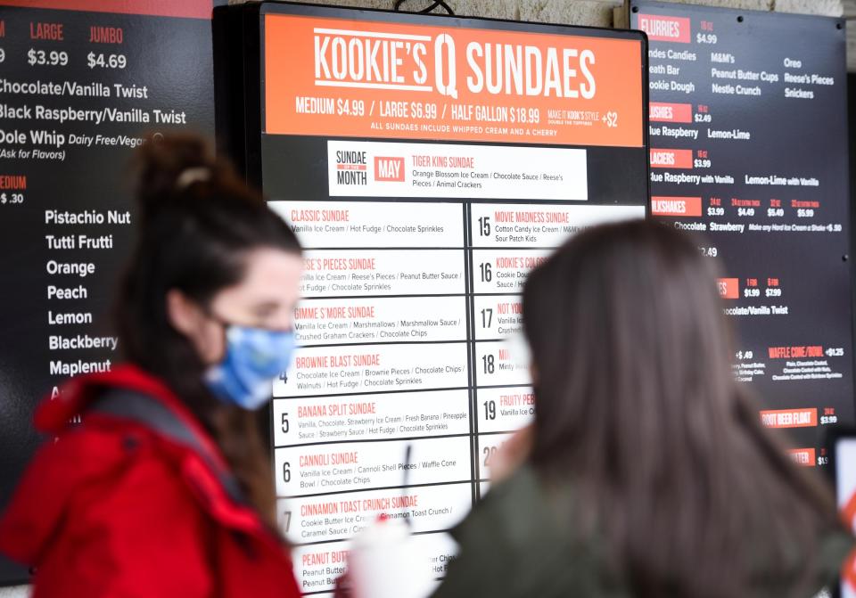 Ice cream flavors and specials are displayed outside of Kookie's Q and Creamery in North Utica. Kookie's Q and Creamery opened in 2021 and recently has added two more locations in Marcy and at the Utica Zoo.