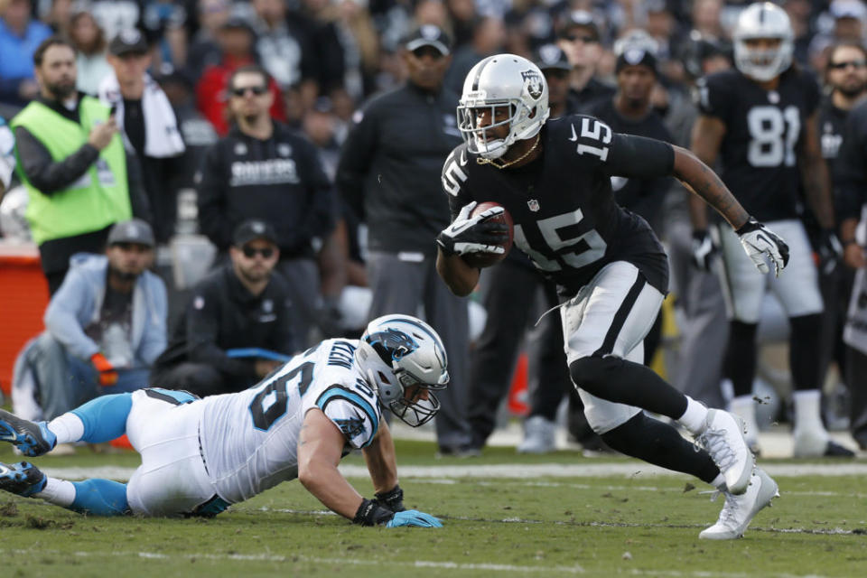 Nov 27, 2016; Oakland, CA, USA; Oakland Raiders wide receiver Michael Crabtree (15) runs with the ball after making a catch against the Carolina Panthers in the second quarter at Oakland Coliseum. Mandatory Credit: Cary Edmondson-USA TODAY Sports