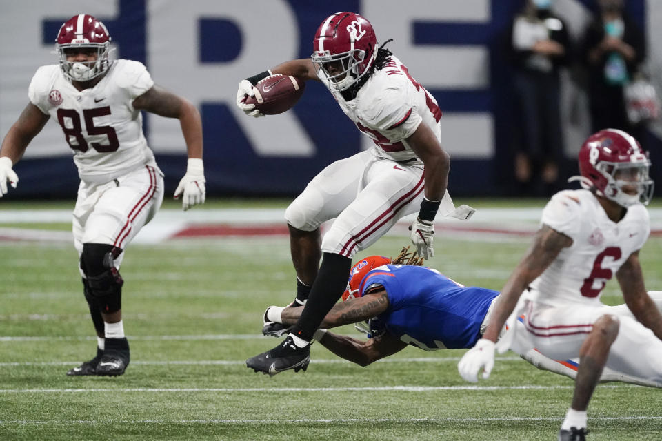 Alabama running back Najee Harris (22) runs against Florida during the second half of the Southeastern Conference championship NCAA college football game, Saturday, Dec. 19, 2020, in Atlanta. (AP Photo/John Bazemore)