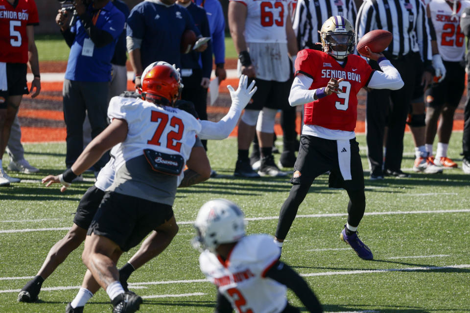 National quarterback Michael Penix Jr. (9) of Washington throws a pass during practice for the Senior Bowl NCAA college football game, Tuesday, Jan. 30, 2024, in Mobile, Ala. (AP Photo/ Butch Dill)