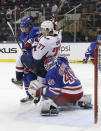 New York Rangers' Libor Hajek (25) and Alexandar Georgiev (40) defend against Washington Capitals' T.J. Oshie (77) during the second period of an NHL hockey game Wednesday, May 5, 2021, in New York. (Bruce Bennett/Pool Photo via AP)