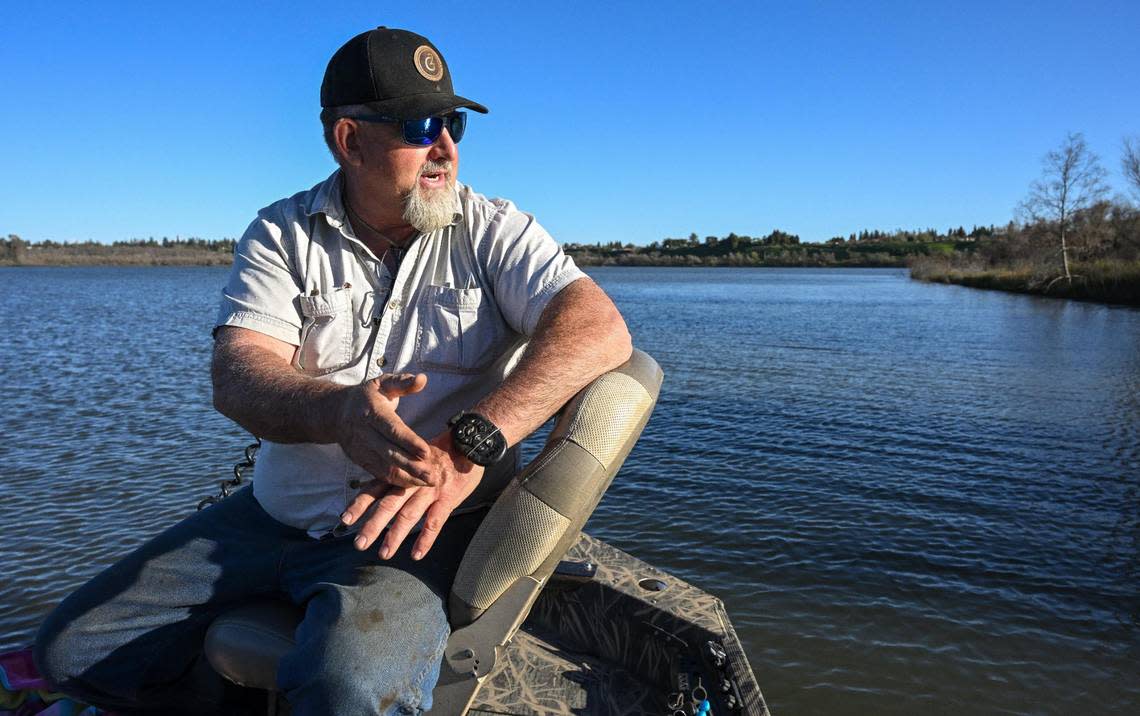 Fishing guide Louis Moosios looks out onto Milburn Pond while talking about potential changes that could affect the ecosystem of the pond north of Fresno on Thursday, March 14, 2024.