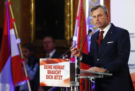 Austrian presidential candidate Norbert Hofer of the FPOe delivers a speech during his final election rally in Vienna, Austria, December 2, 2016. The text on the poster reads "Your home country needs you now". REUTERS/Leonhard Foeger
