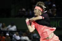 Mar 21, 2018; Key Biscayne, FL, USA; Jared Donaldson of the United States hits a backhand against Marcos Baghdatis of Cyprus on day two of the Miami Open at Tennis Center at Crandon Park. Donaldson won 6-3, 6-4. Geoff Burke-USA TODAY Sports