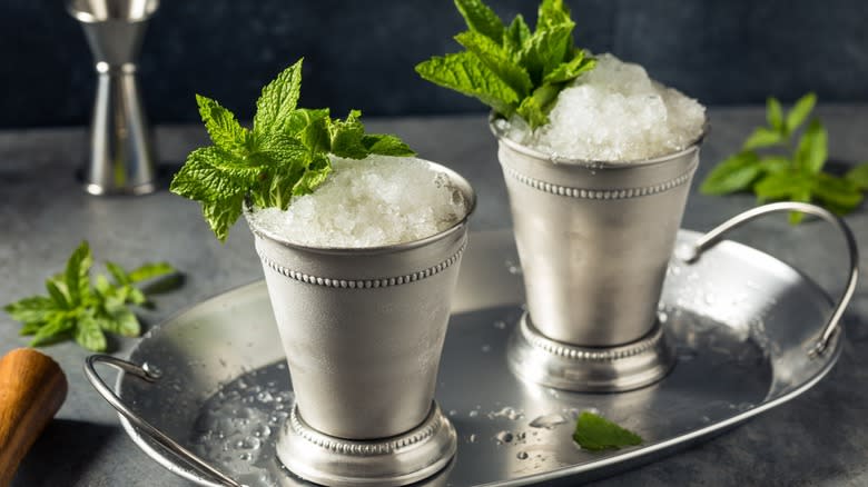 Two mint juleps on metal tray