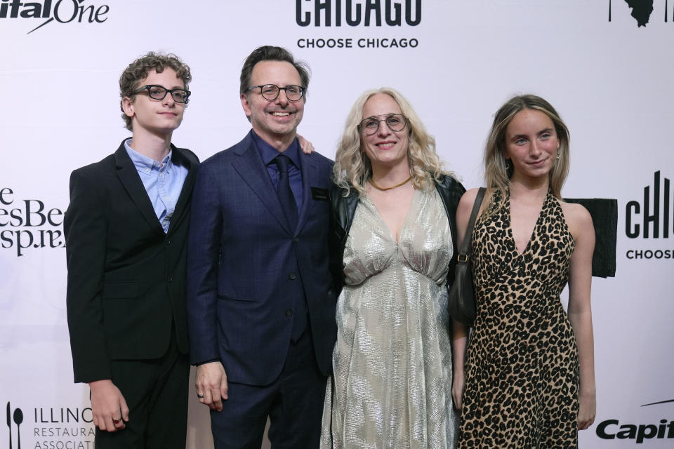 Chef and owner Jason Hammel, second from left, and his wife Lea Tshilds, to his right, representing Chicago's Lula Cafe, attend the James Beard Awards, Monday, June 10, 2024, in Chicago. Lula Cafe won the James Beard Award for Outstanding Hospitality. (AP Photo/Erin Hooley)