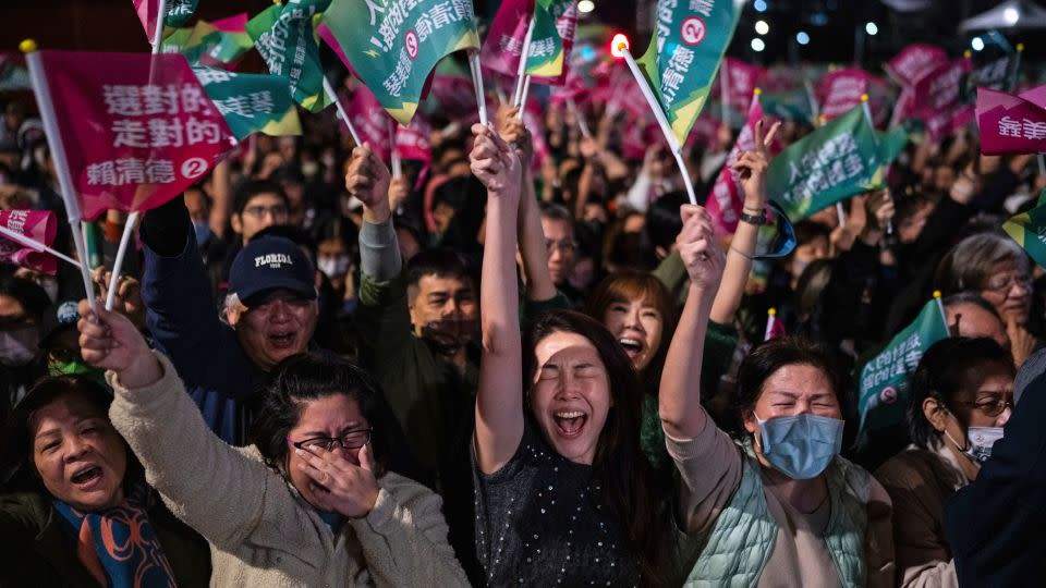 Crowds cheer at a Democratic Progressive Party rally in Taipei after the party's historic victory on Jan. 13, 2024. - Louise Delmotte/AP