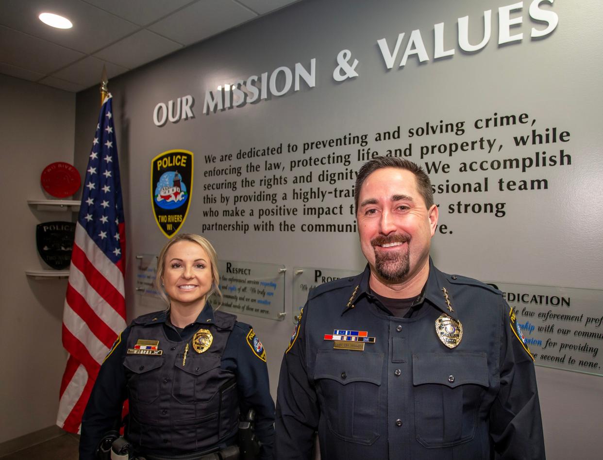 Two Rivers Police Assistant Chief Melissa Weissner, left, and Police Chief Ben Meinnert pose at police headquarters, Monday, February 20, 2023, in Two Rivers, Wis.